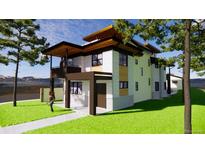 Stunning exterior elevation showcasing a modern two-story home with a balcony and well-manicured lawn at 300 S Franklin St, Denver, CO 80209