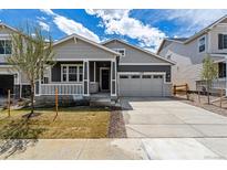 Charming single Gathering home featuring a cozy front porch and a two-car attached garage at 24788 E 40Th Ave, Aurora, CO 80019