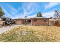 Charming brick home with a well-maintained front yard, offering a classic and inviting curb appeal at 9231 Irving St, Westminster, CO 80031