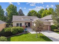 Charming single-Gathering home with a well-manicured lawn and mature trees in a desirable neighborhood at 1026 Deer Clover Way, Castle Pines, CO 80108