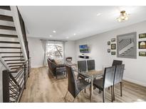 Bright living room featuring modern furnishings and a large window bringing natural light at 7340 E Princeton Ave, Denver, CO 80237
