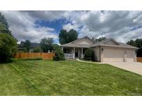 Charming single-Gathering home with manicured lawn and a spacious three-car garage at 13112 Summit Grove Pkwy, Thornton, CO 80241
