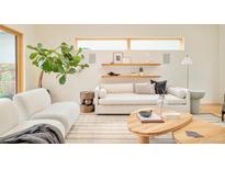 Cozy living room with stylish decor, comfortable seating, and plenty of natural light at 1452 S Washington St, Denver, CO 80210