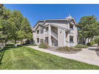 Inviting condo exterior with well-maintained landscaping and private entrance at 1148 Opal St # 101, Broomfield, CO 80020