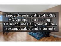 Bright living room with hardwood floors and modern decor offers prepaid HOA for three months at 1196 N Grant St # 407, Denver, CO 80203