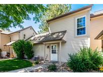 Charming home exterior with a beige facade, landscaped yard, and inviting front entrance at 2101 S Victor St # C, Aurora, CO 80014