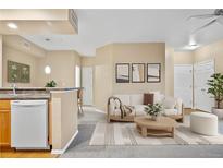 Inviting living room featuring a comfortable sofa, modern decor, and an open layout at 8422 S Upham Way # G47, Littleton, CO 80128