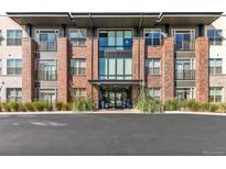 Brick building exterior with modern design and landscaping at 155 S Monaco Pkwy # 302, Denver, CO 80224