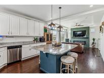 Beautiful, modern kitchen with a large island, granite countertops, and stainless steel appliances at 10560 Waco St, Commerce City, CO 80022