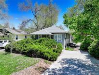 Charming home with a well-manicured front yard and a cozy, inviting exterior at 150 S Garfield St, Denver, CO 80209