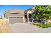Charming single-Gathering home featuring a two-car garage and well-maintained front yard at 12652 Glencoe St, Thornton, CO 80241