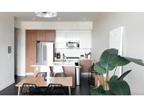 Modern kitchen featuring stainless steel appliances, light countertops and a peninsula with barstool seating at 2880 Zuni St # 406, Denver, CO 80211