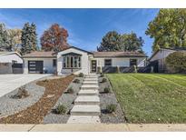 Updated mid-century ranch with modern exterior and landscaping at 3058 S Cook St, Denver, CO 80210