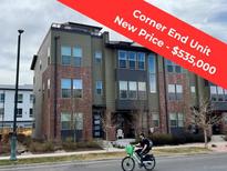 Attractive end-unit townhome with brick accents and modern design, offering a stylish exterior at 8742 E 47Th Ave, Denver, CO 80238