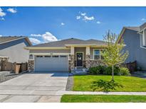 Charming single-Gathering home featuring a well-kept lawn and a two-car garage at 3086 Kestrel St, Brighton, CO 80601