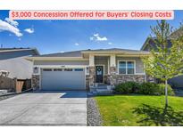 Charming single-story home with stone accents, a two-car garage, and a well-maintained lawn at 3086 Kestrel St, Brighton, CO 80601