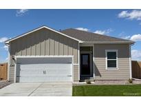 Charming single-story home boasts neutral siding, a well-manicured lawn, and an attached two-car garage at 2245 Alyssa St, Fort Lupton, CO 80621