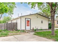 Charming single-story home features a well-manicured lawn and quaint entryway at 5532 Umatilla St, Denver, CO 80221