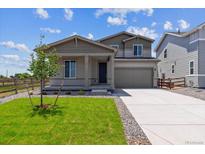 Charming two-story home featuring a well-manicured lawn and a two-car garage, perfect for a modern Gathering at 5918 Red Barn Ave, Mead, CO 80504
