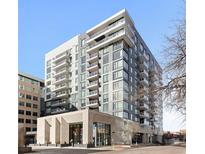 Modern building featuring multiple floors with balconies and large windows offers city views at 155 Steele St # 917, Denver, CO 80206