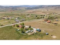 Sweeping aerial view of the rural property with picturesque mountain views and serene surroundings at 6310 W County Road 4, Berthoud, CO 80513