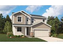 Charming two-story home featuring a two-car garage, stone accents, neutral colors, and manicured lawn at 4479 Boone Cir, Brighton, CO 80601