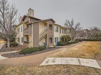 This home boasts a two story floor plan with an outdoor patio and beautiful landscape at 5455 S Dover St # 101, Littleton, CO 80123
