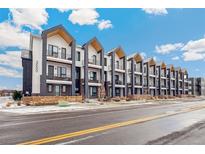 Modern townhome exteriors with balconies offer stylish urban living and beautiful architectural details at 3550 Uinta St # 6, Denver, CO 80238