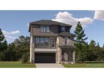 A modern two-story home featuring stone accents, a covered porch and a two car garage in a desirable neighborhood at 2190 S Haleyville Way, Aurora, CO 80018