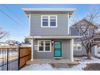 Gray two-story house with teal door and small front yard at 3428 S Sherman St, Englewood, CO 80113