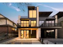 Modern two-story home with light stone and dark metal accents at 334 Steele St, Denver, CO 80206