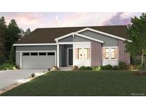 Charming single-Gathering home with brick accents, a two-car garage, and a well-manicured lawn at 1400 Colony Dr, Erie, CO 80026