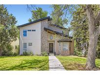 Striking contemporary home with manicured lawn and modern architectural details at 1533 S Columbine St, Denver, CO 80210