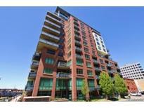 Brick building exterior with balconies and city views at 1401 Wewatta St # 309, Denver, CO 80202