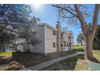 Charming townhouse featuring a stone chimney and private balcony at 14171 E Jewell Ave # 203, Aurora, CO 80012