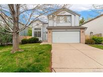 Charming two-story home with a brick-accented garage and well-maintained front lawn, offering classic suburban appeal at 1842 Reliance Cir, Superior, CO 80027