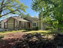 Charming home features a well-manicured front yard and inviting exterior at 2090 S Fairplay St, Aurora, CO 80014