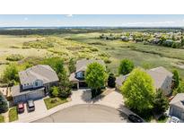 Beautiful neighborhood with homes and large open space, creating a serene and picturesque setting at 7852 Solstice Way, Castle Rock, CO 80108