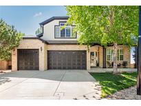 Charming two-story home with brick and light siding, spacious three-car garage, and a well-maintained front yard at 7852 Solstice Way, Castle Rock, CO 80108