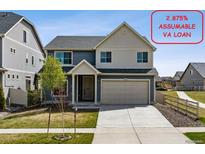 Charming two-story home with a two car garage, mature landscaping, and assumable VA loan at 5352 Truckee St, Denver, CO 80249