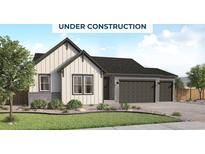 Charming two-story home with modern farmhouse architecture, three-car garage, and professionally landscaped front yard at 400 Clear Bell Ln, Monument, CO 80132
