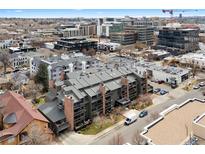 An aerial view of a modern multi-Gathering unit showcases its rooftop design and surrounding downtown neighborhood at 350 Detroit St # 107, Denver, CO 80206