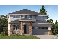 Charming two-story home featuring a two-car garage and a welcoming front porch at 687 Raindance St, Erie, CO 80516