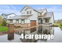Charming two-story home with a 4 car garage and a covered porch at 42225 Kingsmill Cir, Elizabeth, CO 80107