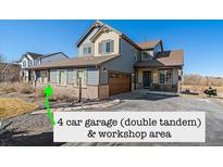 Charming two-story home with a four car garage and brick accents at 42225 Kingsmill Cir, Elizabeth, CO 80107