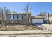 Charming two-story home with a two-car garage, inviting curb appeal, and potential for landscaping at 2522 W 100Th Ave, Federal Heights, CO 80260