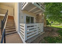 Condo exterior features a balcony, natural light, and staircase access to unit 108 at 8555 Fairmount Dr # A108, Denver, CO 80247