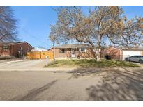 Brick ranch home with mature trees and a spacious yard at 1947 E 117Th Way, Northglenn, CO 80233