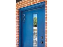 A vibrant blue front door with glass pane and a clear view of the property number 201 at 1 N Pearl St # 201, Denver, CO 80203