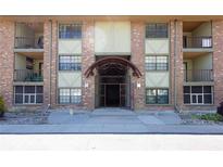 Attractive brick exterior of the building with balconies and gated entrance at 1021 Carr St # 17, Lakewood, CO 80214